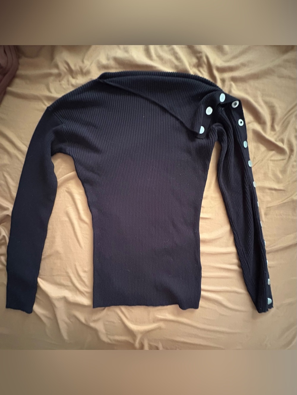 Black ribbed knit long sleeve top with silver buttons